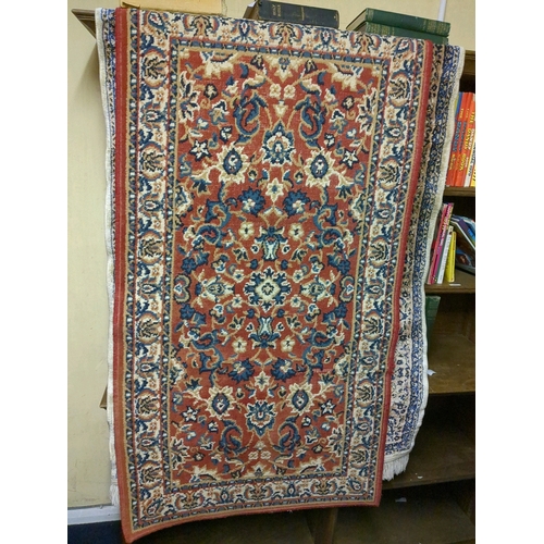 920e - Three rugs, green, red and cream/blue, approx 175cm x 60cm,  145cm x 80cm and 134 x 95cm