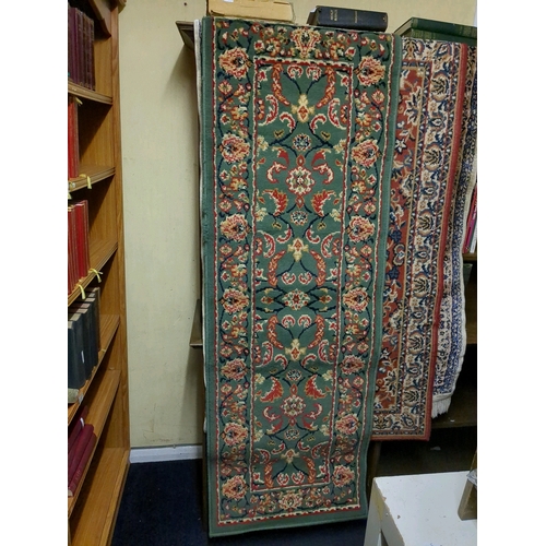 920e - Three rugs, green, red and cream/blue, approx 175cm x 60cm,  145cm x 80cm and 134 x 95cm