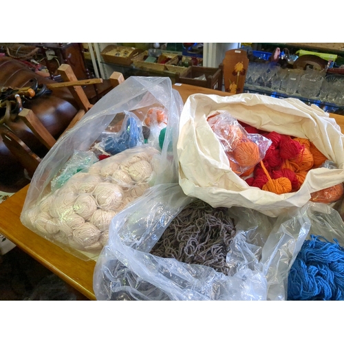 939C - Large plastic wheeled storage container full to the brim with various wools and yarns, some Aran wei... 