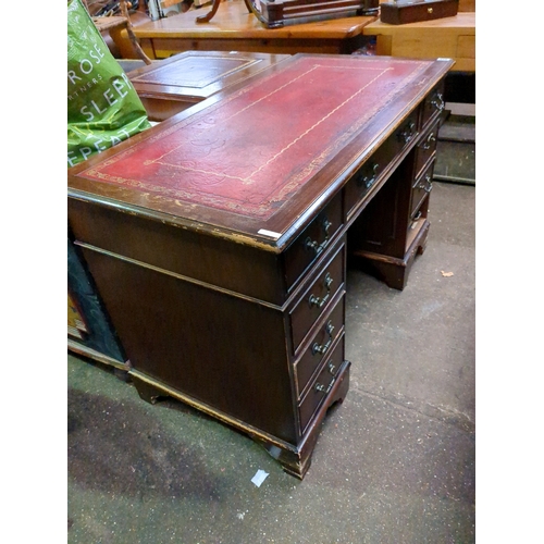 955 - Leather topped pedestal desk.  Signs of wear to edges.  Cock beading missing from one drawer and onl... 