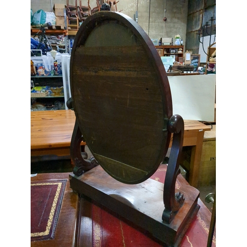 957 - An imposing oval Victorian mahogany dressing table mirror with secret drawer.  Measures 82cmH x 61cm... 