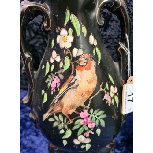 17 - Porcelain black painted mantle clock with Robin bird design with two English made complementary vase... 