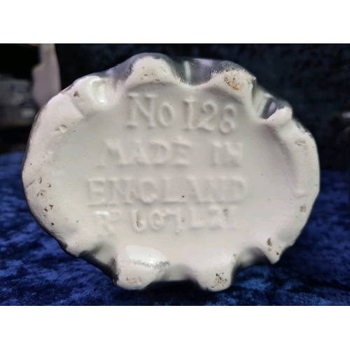 17 - Porcelain black painted mantle clock with Robin bird design with two English made complementary vase... 