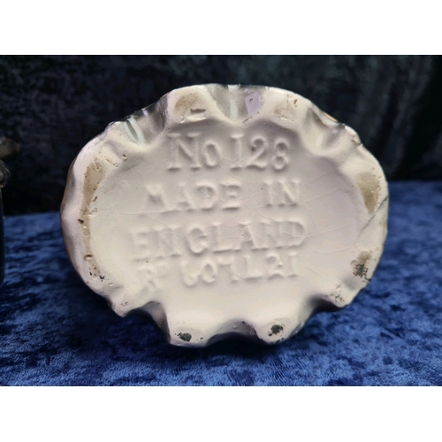 17 - Porcelain black painted mantle clock with Robin bird design with two English made complementary vase... 