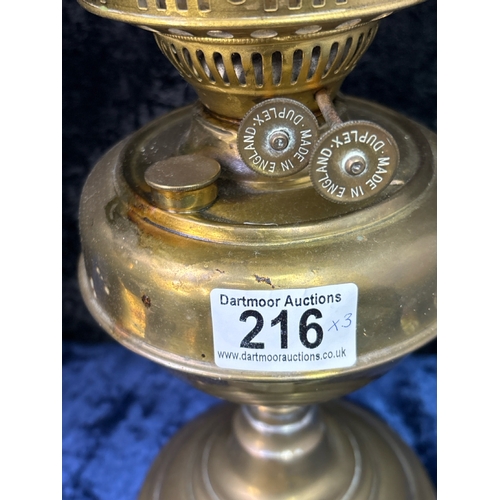 216 - 2 brass and glass vintage oil lamps and a brass table lamp