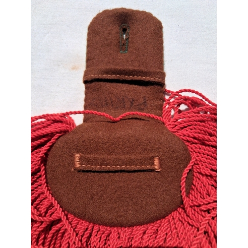 131 - French legion shoulder boards and a cloth badge