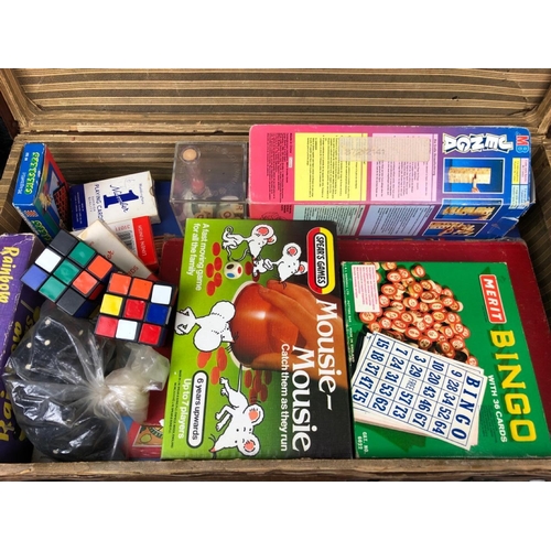 123 - Vintage suitcase full of vintage games from Mousie Mousie to Rubik’s Cubes.