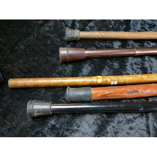 350 - Two metal and three wooden walking sticks, very useful for a hike up the Tor!