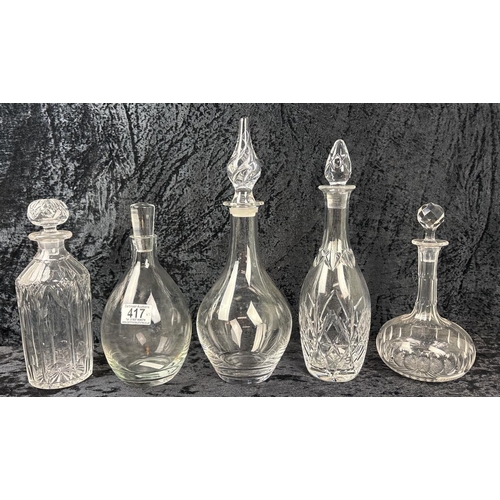 417 - Five modern and vintage, plain and faceted, decanters.