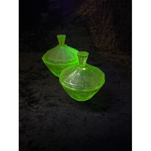 423 - Dressing table set of four uranium green glass items, plus an embossed glass plaque.