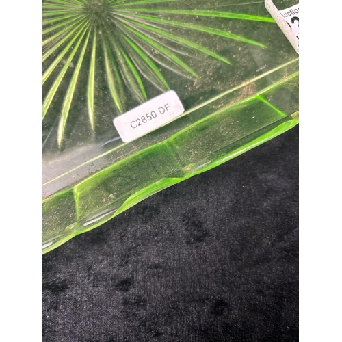 423 - Dressing table set of four uranium green glass items, plus an embossed glass plaque.