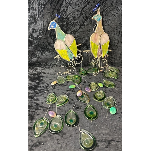 423A - Pair of eye catching glass and metal peacock hanging mobiles. Some glass pieces need reattaching.