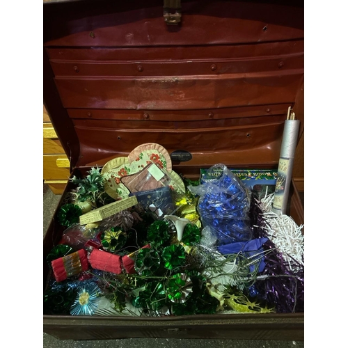 1002 - Large metal trunk full of festive decorations.