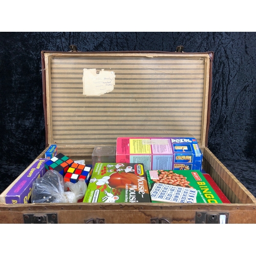 123 - Vintage suitcase full of vintage games from Mousie Mousie to Rubik’s Cubes.
