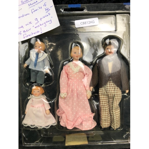 107 - Starter kit for a Victorian doll’s house including a family of figures, mahogany furniture and acces... 