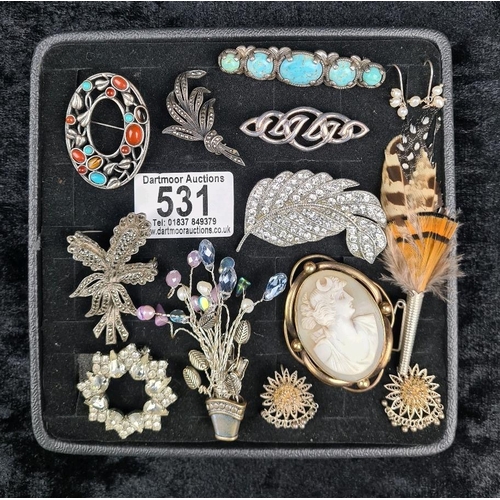 531 - Tray of vintage brooches and two pairs of earrings, including a ‘mirage’ blue stone and metal brooch... 