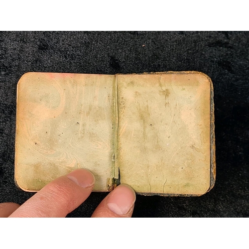 605 - Tennyson’s Poetical Works miniature book with silver front cover bearing portrait of Tennyson. Indis... 