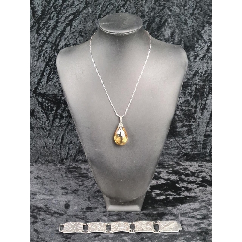 628 - Unmarked white bracelet (clasp a/f) and a silver mounted pendant on a white metal chain