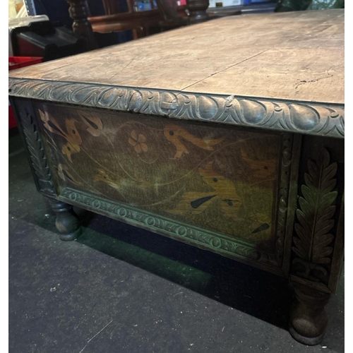 838A - Antique wooden low table with detailed side panels. Approx H39cm x W113cm x D72cm