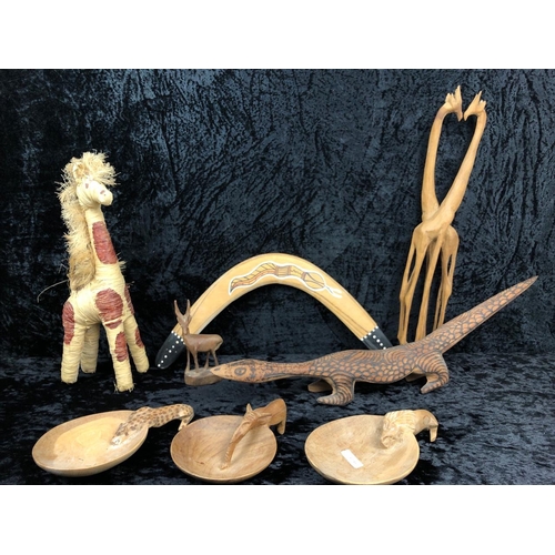 89 - Collection of hand-carved wooden animals and a boomerang.
