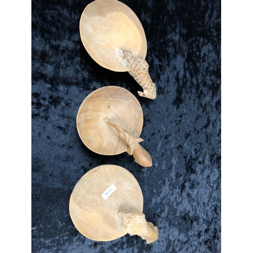 89 - Collection of hand-carved wooden animals and a boomerang.