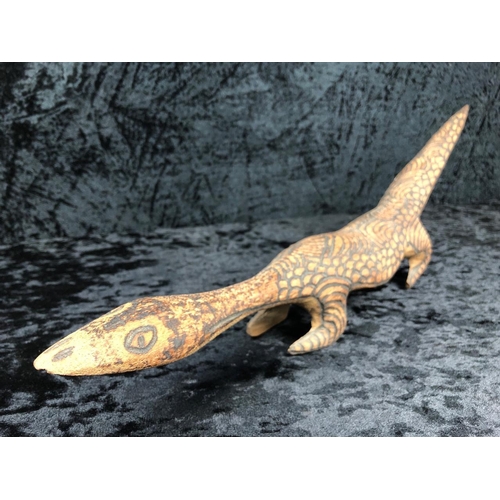 89 - Collection of hand-carved wooden animals and a boomerang.