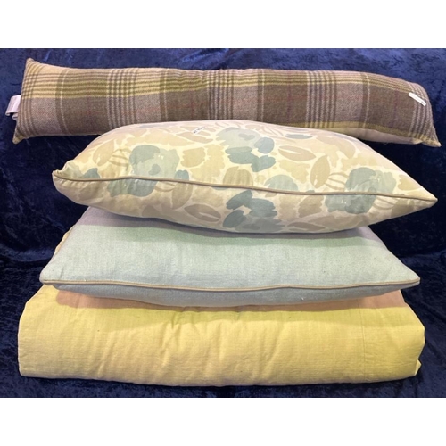 921 - Pair of cream curtains, two cushions and a draught excluder.