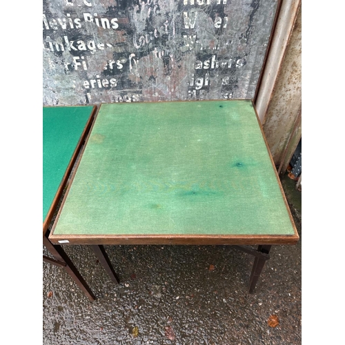 943 - Two vintage baize-topped folding card/games tables. Both approx H70cm x W71cm x D71cm.