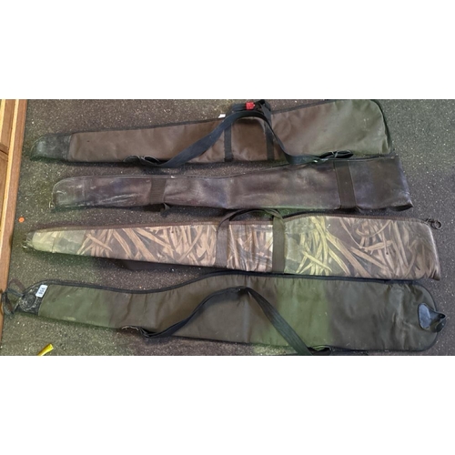 958 - Four fabric rifle bags.