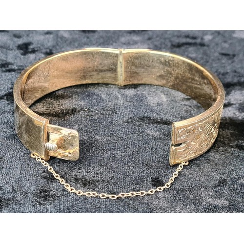 623 - 9ct gold plated decorative hinged bangle with security chain
