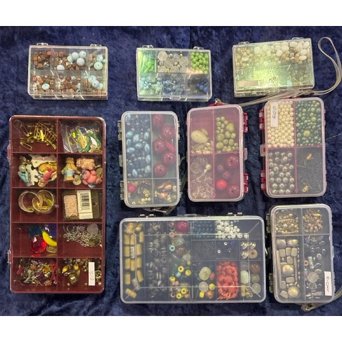 913 - Nine boxes of different type and colour beads.