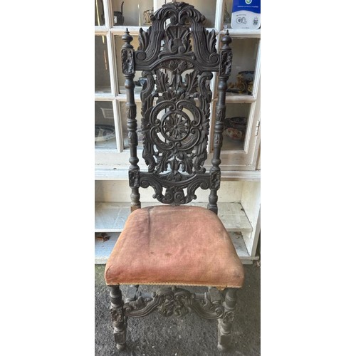 968 - Antique Jacobean Revival carved oak hall chair with a velvet seat cushion.