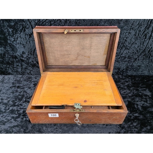 100 - Antique wooden writing slope with pen and inkwells and key. Approx H14 x W40 x D24cm.