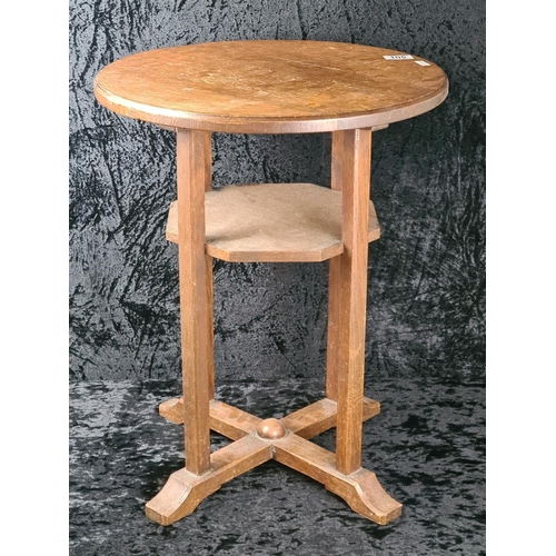 105 - Arts and Crafts circular oak lamp table with an octagonal undertier and an X-frame base. Approx H58c... 