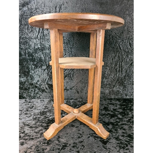 105 - Arts and Crafts circular oak lamp table with an octagonal undertier and an X-frame base. Approx H58c... 