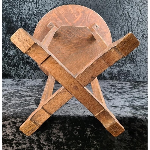 105 - Arts and Crafts circular oak lamp table with an octagonal undertier and an X-frame base. Approx H58c... 