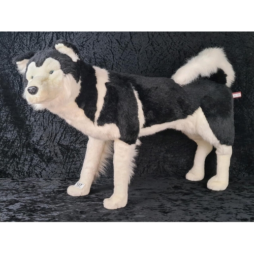 107 - Almost life-size standing husky dog stuffed toy, made by DPL Leeds Ltd. Approx H55cm.