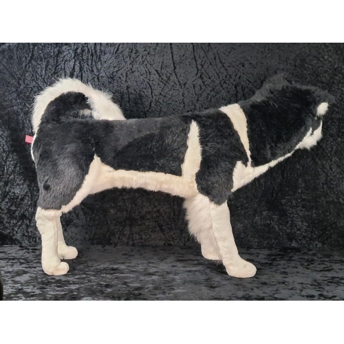 107 - Almost life-size standing husky dog stuffed toy, made by DPL Leeds Ltd. Approx H55cm.
