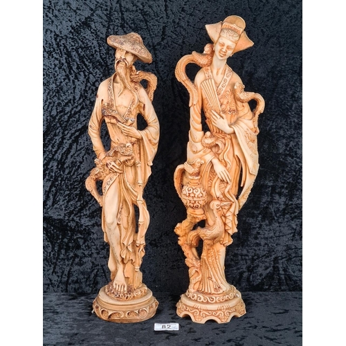 82 - Two mid-20th century heavy resin Oriental figurines depicting a man and a woman. Tallest Approx H49c... 