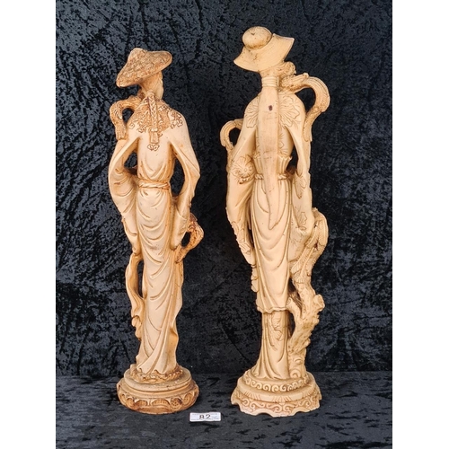 82 - Two mid-20th century heavy resin Oriental figurines depicting a man and a woman. Tallest Approx H49c... 