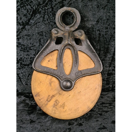 84 - Antique Louden A21 cast iron and wood wheel barn pulley, used for handling hay bales. Approx H26cm.
