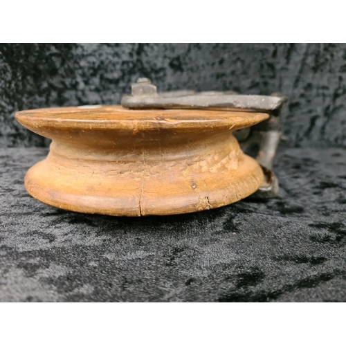 84 - Antique Louden A21 cast iron and wood wheel barn pulley, used for handling hay bales. Approx H26cm.