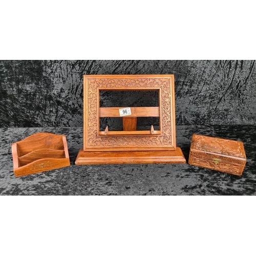 96 - Set of wooden, carved desk accessories, including a book stand/easel, a letter holder, and a box con... 