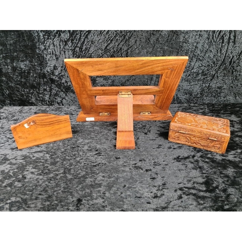 96 - Set of wooden, carved desk accessories, including a book stand/easel, a letter holder, and a box con... 