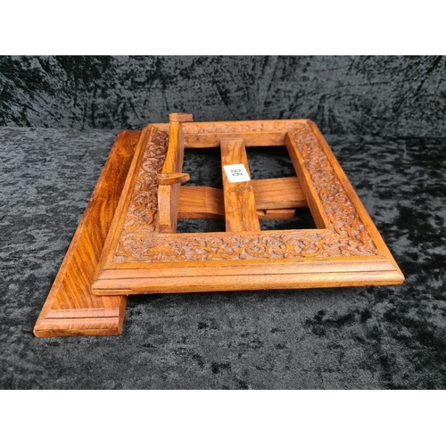 96 - Set of wooden, carved desk accessories, including a book stand/easel, a letter holder, and a box con... 