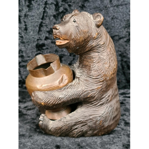 335 - Black Forest style carved brown bear holding a copper pot approx H12cm