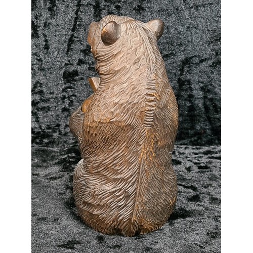 335 - Black Forest style carved brown bear holding a copper pot approx H12cm