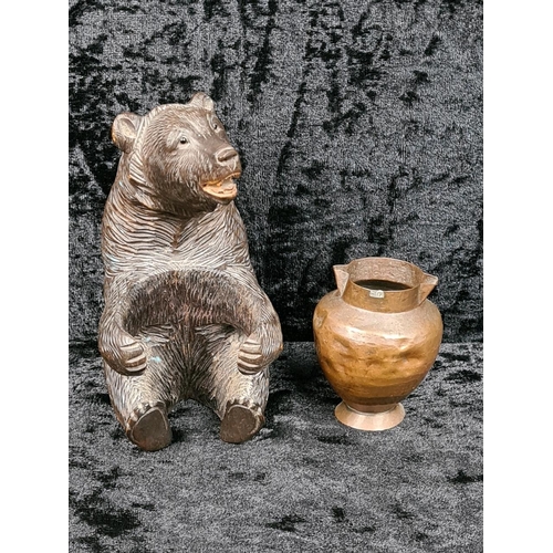 335 - Black Forest style carved brown bear holding a copper pot approx H12cm