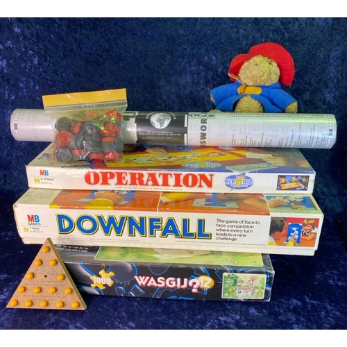 240 - Vintage Paddington bear with tag from Eden toys along with a collection of vintage games, relive you... 