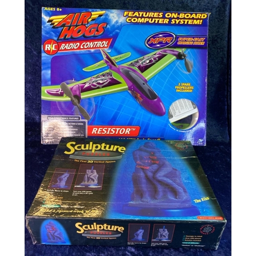 241 - Air Hogs radio controlled plane in box and boxed 3d sculpture puzzles.